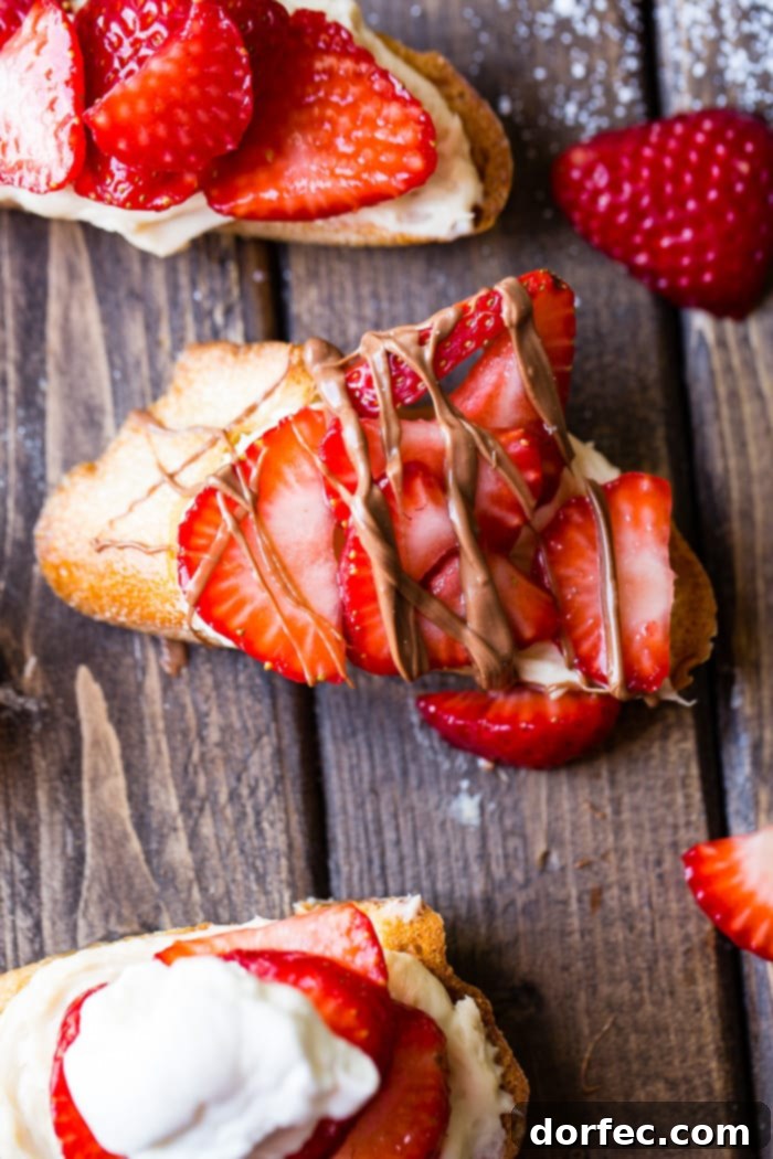 Golden Brown Sugar Strawberry Crostini 6 A brown board with beautifully arranged Brown Sugar Strawberry Crostinis and a subtle chocolate drizzle, perfect for a sweet treat.
