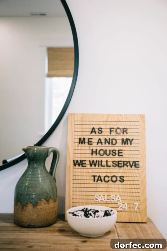 A stylish Emerie Lane Letter Board featuring a fun taco quote, positioned as a welcoming and interactive element in the guest bedroom.