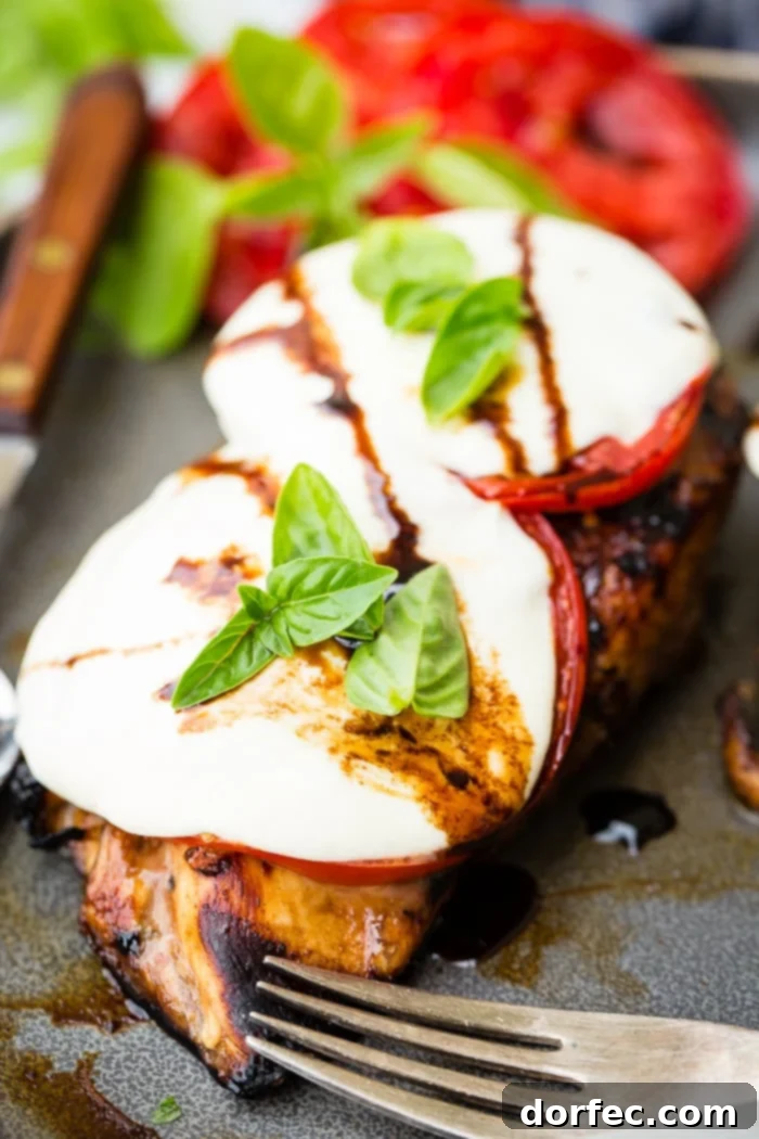 Balsamic Glazed Caprese Chicken with fresh tomatoes, mozzarella, and basil
