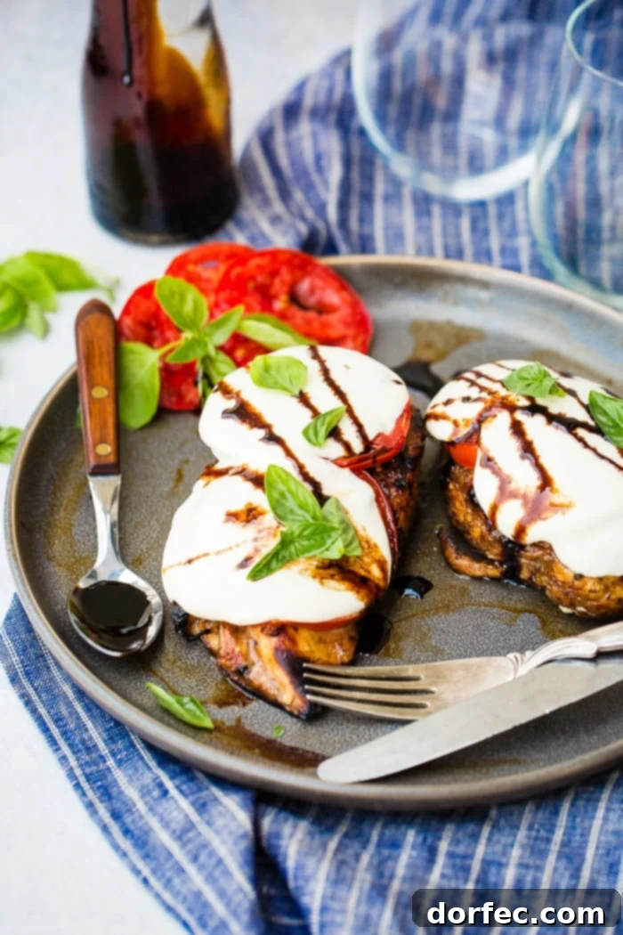 Balsamic Caprese Chicken, close-up with melted cheese and fresh basil