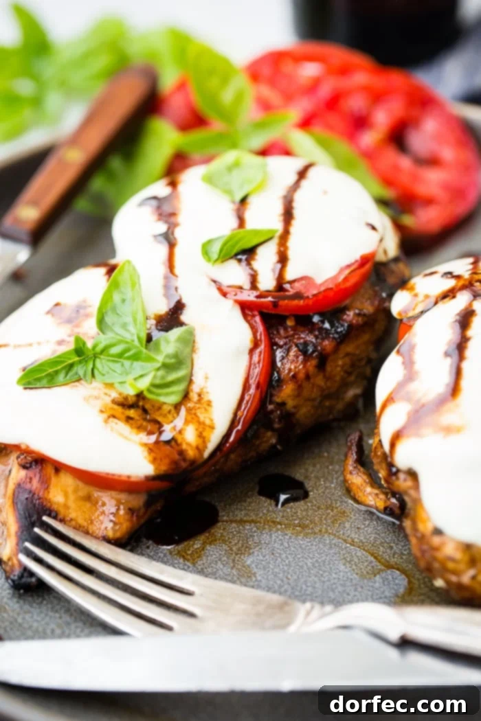 Balsamic Caprese Chicken served on a plate, garnished with fresh basil