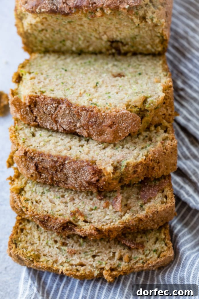 A close up of a loaf of cinnamon sugar zucchini bread