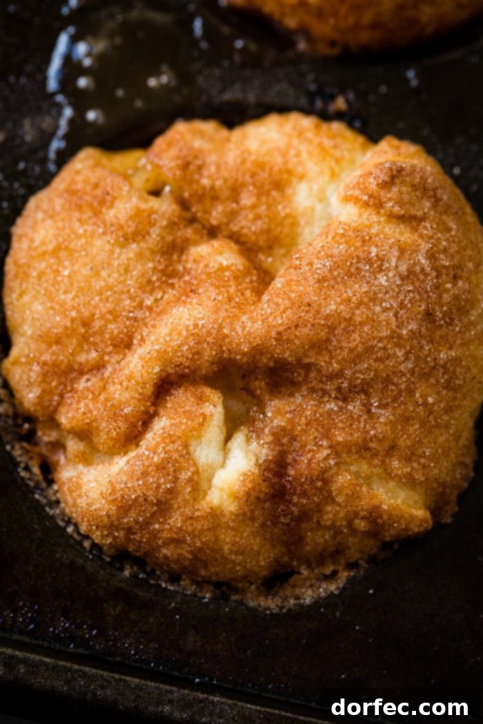 An enticing view of a stack of Apple Empty Tomb Rolls, showcasing their fluffy texture and delicious filling.