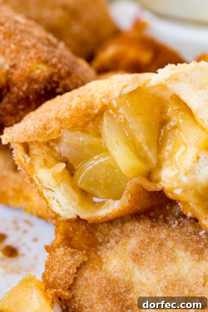 A close-up shot showcasing the beautiful golden crust of an Apple Empty Tomb Roll, ready to be enjoyed.