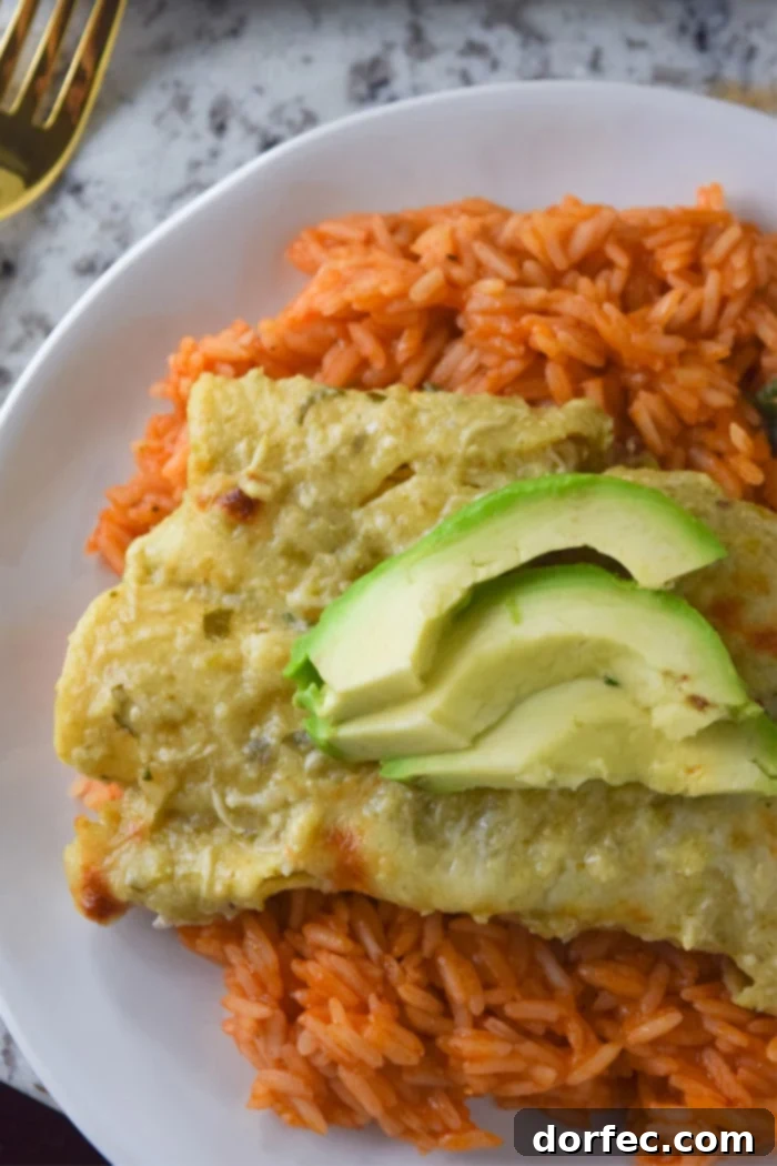 Cheesy chicken enchiladas baked with a homemade roasted tomatillo sauce.