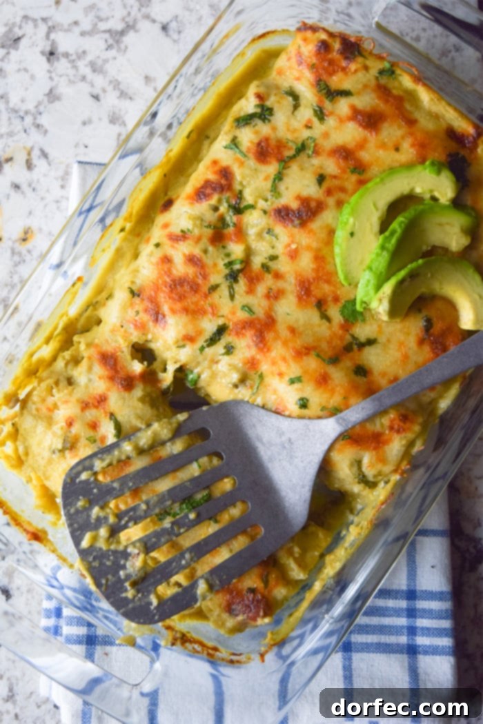 Cheesy chicken enchiladas baked with a homemade roasted tomatillo sauce.