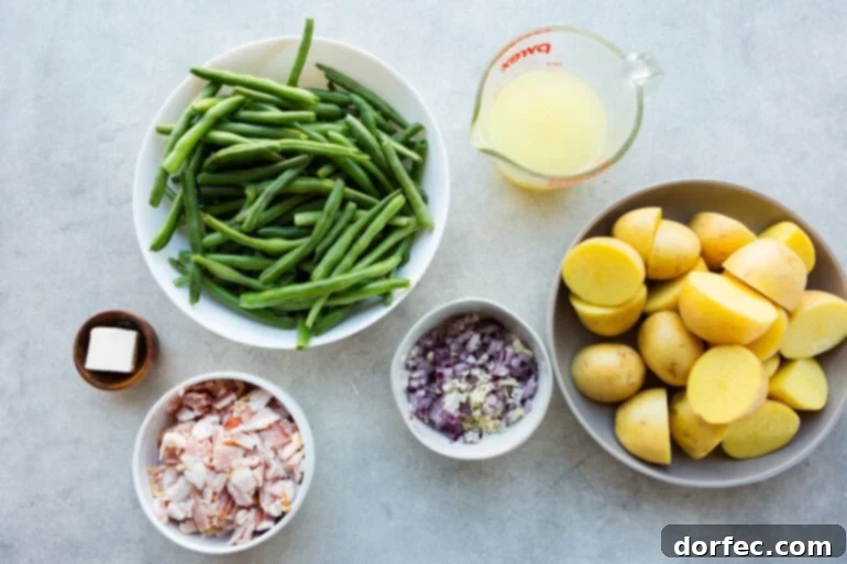A photo of all the ingredients for green beans and potatoes laid out in separate bowls.