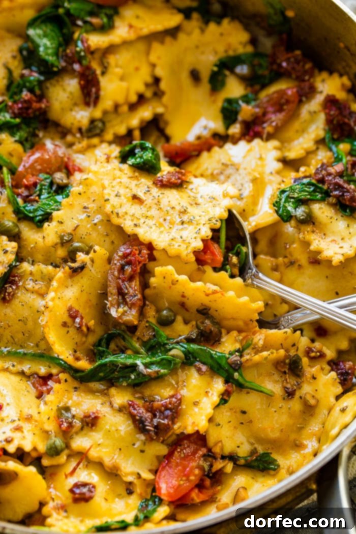 A close-up shot of the Crispy Pancetta Ravioli with Sun-Dried Tomatoes and Spinach, highlighting the golden-brown pancetta pieces.