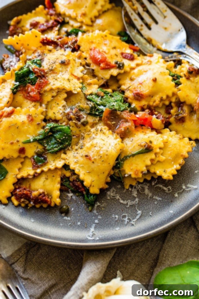 Close-up of the flavorful Crispy Pancetta Ravioli, rich with sun-dried tomatoes and spinach, in a pan.