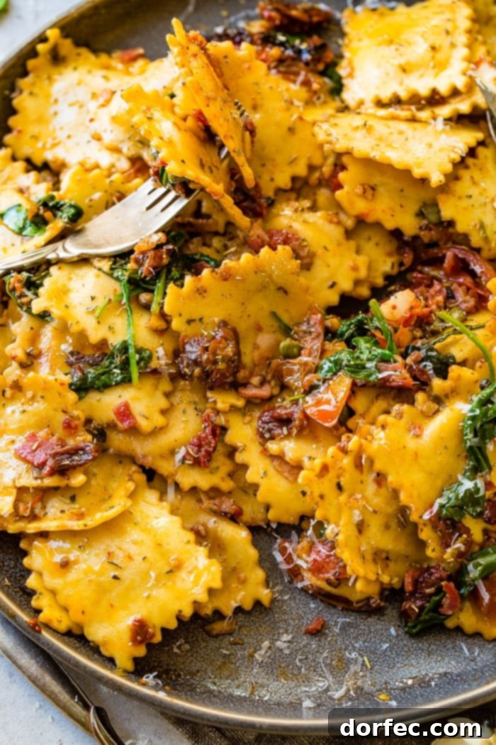 A vibrant and satisfying plate of Easy Crispy Pancetta Ravioli with Sun-Dried Tomatoes and Spinach, ready to be enjoyed.
