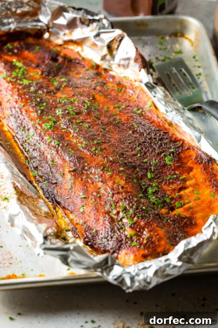 Maple salmon in foil on a baking sheet, ready to be served