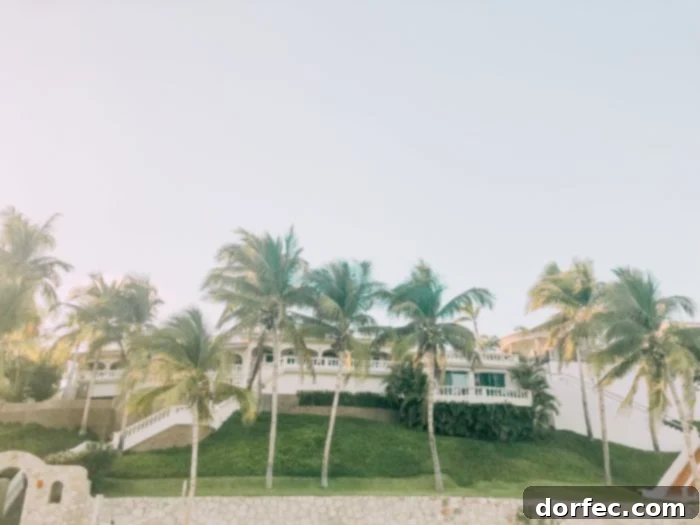 An aerial view of a luxurious mansion in Mexico, ideal for weddings, parties, and large family gatherings, set against a stunning coastal backdrop.