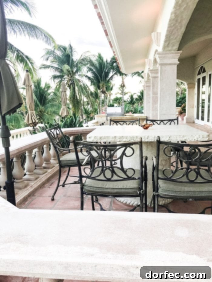 The luxurious outdoor living space of Casa Mariposa, a grand mansion for rent in San Jose del Cabo, perfect for gatherings and relaxation by the pool.
