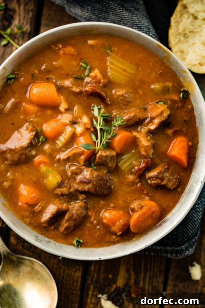 A closer look at a bowl of Irish Beef Stew, highlighting the rich gravy and the perfectly cooked beef and vegetables.