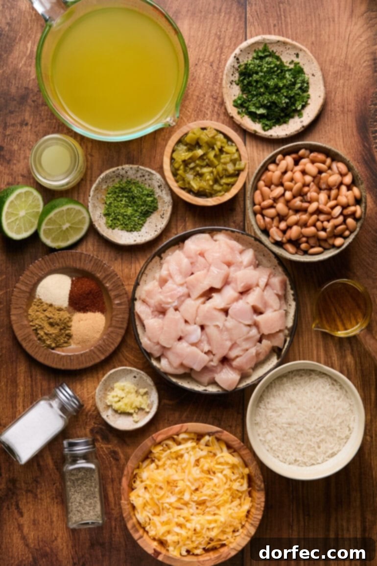 Flavor-Packed Instant Pot Cilantro Lime Chicken Burrito Bowls 3 A collection of fresh ingredients for Instant Pot Cilantro Lime Chicken Burrito Bowls, neatly arranged in small bowls and plates, showcasing vibrant colors and textures.