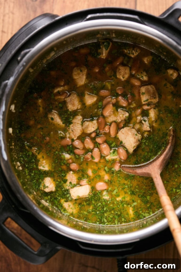 Flavor-Packed Instant Pot Cilantro Lime Chicken Burrito Bowls 9 All ingredients combined in the Instant Pot, stirred and ready for the lid to be sealed and pressure cooking to begin.