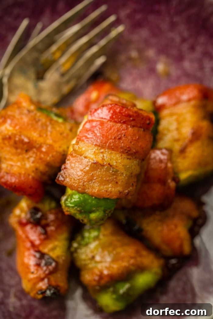 Crispy Bacon Avocado Wraps 6 This Bacon Wrapped Avocados appetizer recipe is sure to win over everyone you know.Crispy brown sugar bacon wrapped around a creamy avocado, and it's easy!