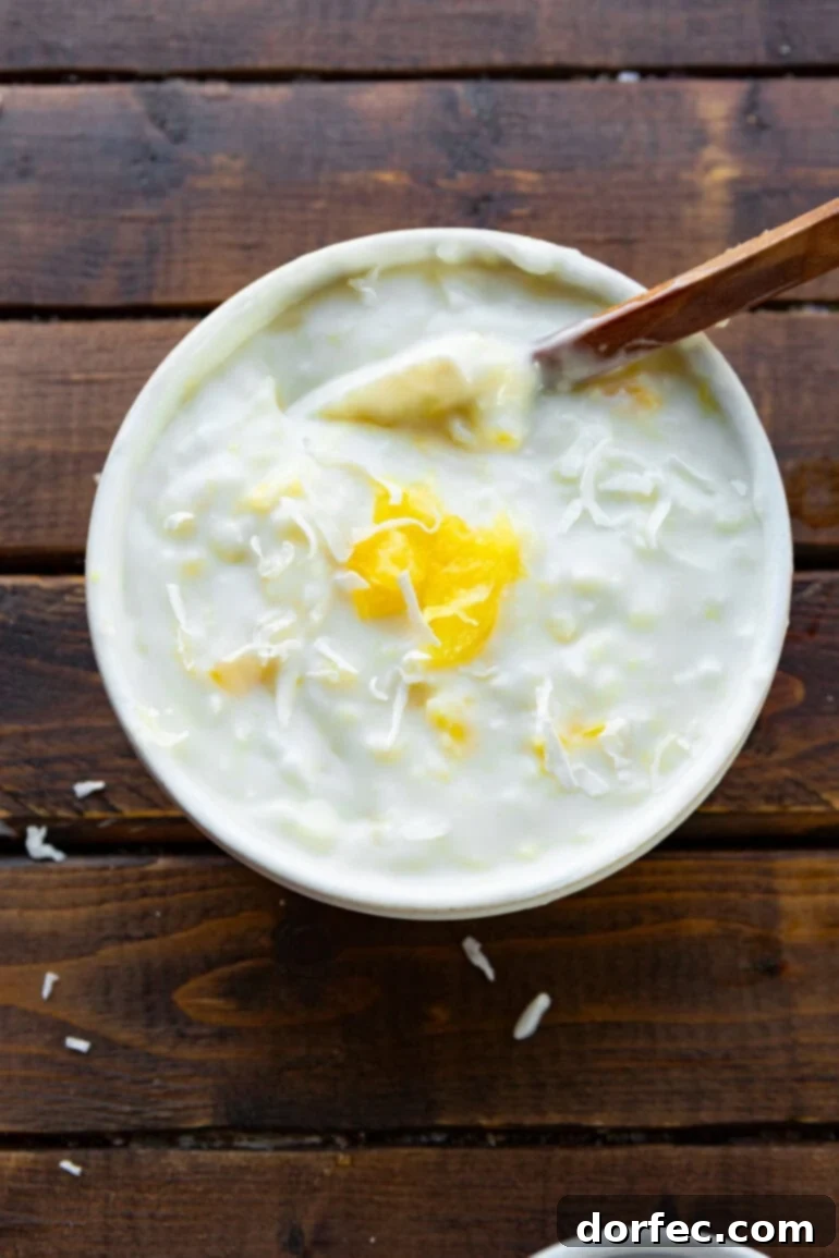 a photo of a small bowl full of pina colada dipping sauce for ham