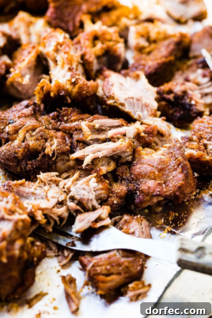 Instant Pot Country Ribs with Video Guide 3 A savory pile of pulled pork with homemade barbecue sauce clinging to every bite.