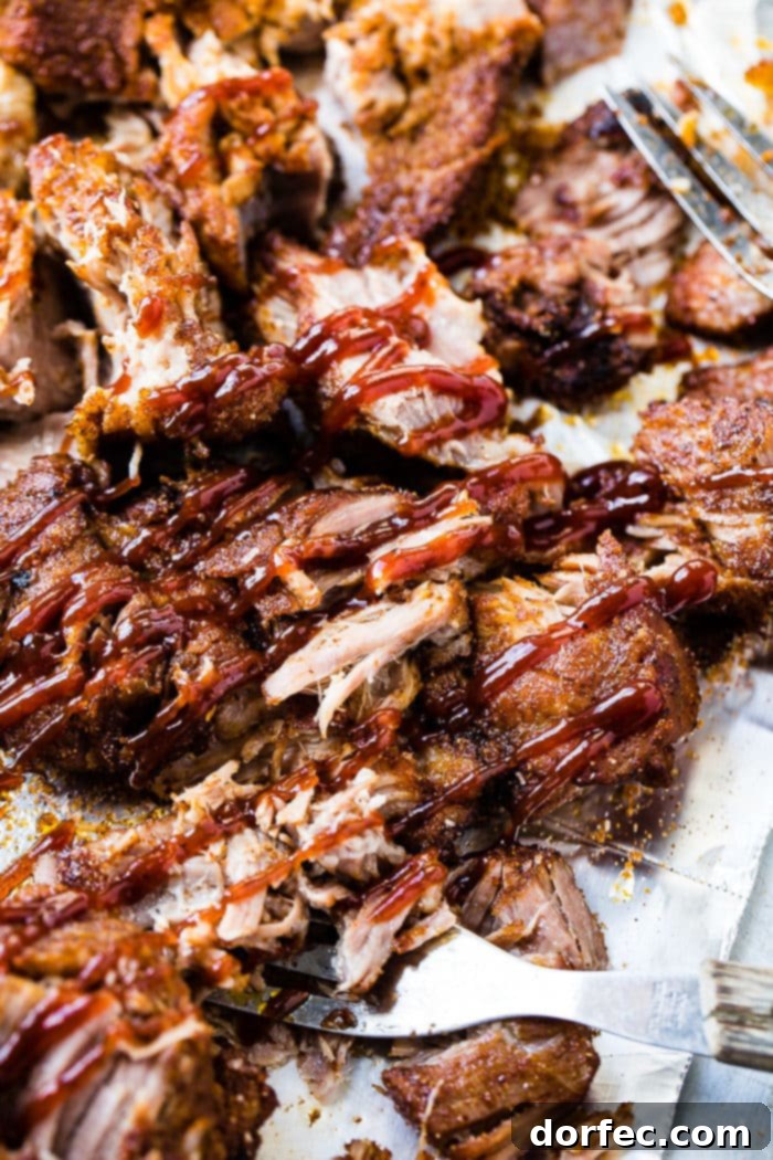 Instant Pot Country Ribs with Video Guide 5 A photo of rib meat smothered in homemade BBQ sauce.