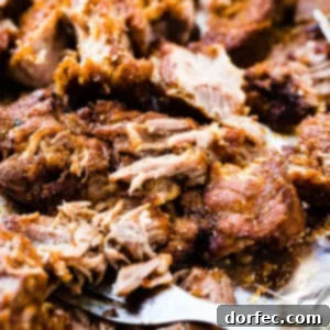 A photo of shredded country style ribs covered in homemade BBQ sauce.