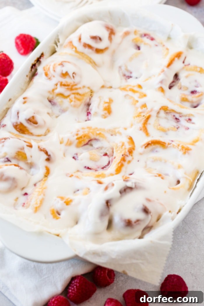 A photo of a pan of easy berry sweet bread covered in frosting.