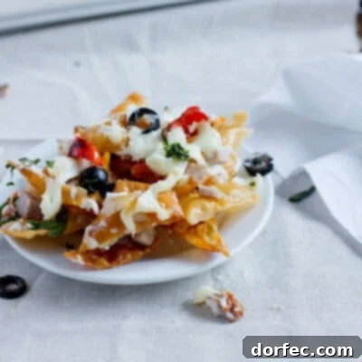 Gooey Italian Nachos with Alfredo sauce, a unique appetizer