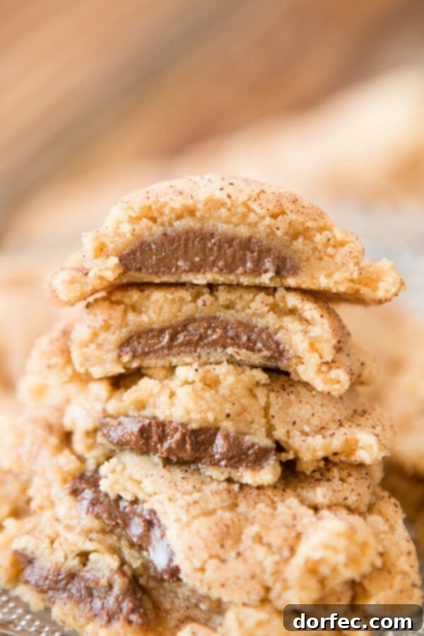 Soft and fluffy peanut butter meltaway cookies stuffed with melty chocolate wafers
