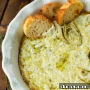 A delicious creamy artichoke dip, freshly baked and ready to serve.