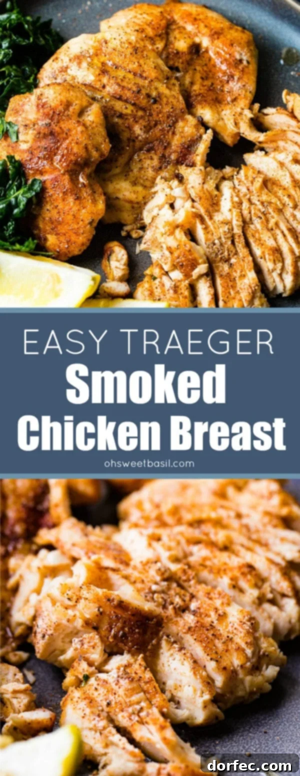 Effortless Traeger Smoked Chicken Breasts 8 A photo of whole smoked chicken breasts and sliced smoked chicken breasts on a charcoal gray plate with lemon wedges and kale on the side.