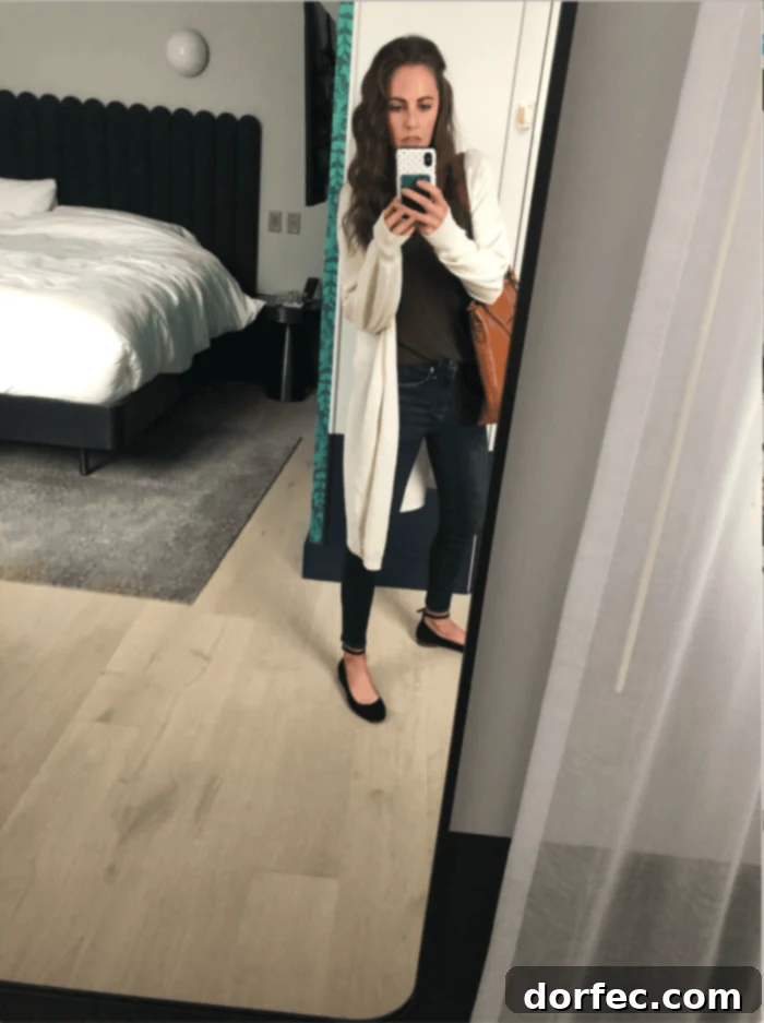 Road Trip Ready Smart Snacks and Fun Printables 13 A mirror selfie captured inside a hotel room, offering a glimpse into the traveler's temporary abode and personal style.
