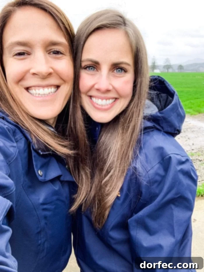 Road Trip Ready Smart Snacks and Fun Printables 14 Two friends sharing a joyful moment, smiling warmly at the camera during their visit to Tillamook Farms in Oregon, capturing the essence of their shared experience.