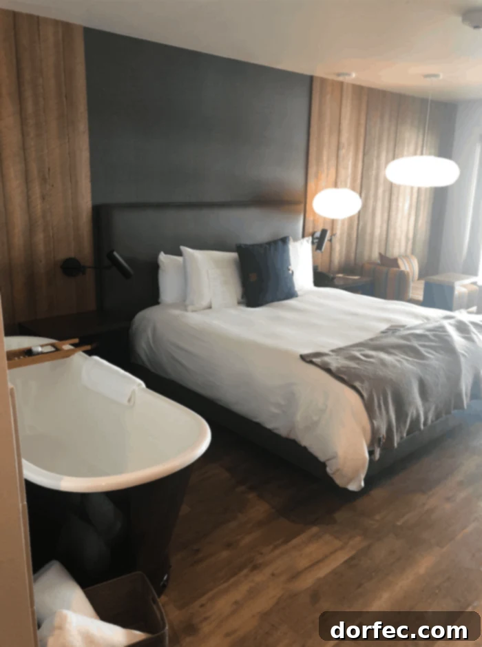 Road Trip Ready Smart Snacks and Fun Printables 9 An inviting photo of a luxurious hotel room at Headlands Lodge and Spa in Pacific City, Oregon. The elegantly appointed space promises comfort and relaxation, with thoughtful details designed for a serene coastal escape.