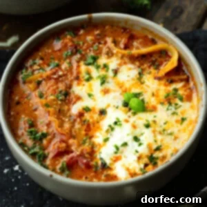 A Bowl of Lasagna Bliss 12 A delicious and comforting bowl of lasagna soup, topped with melted cheese and fresh herbs, in a recipe card context.