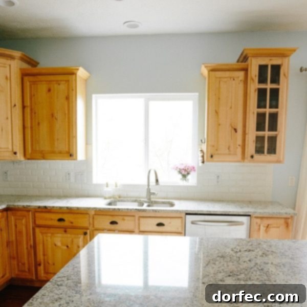 A photo of our kitchen looking over the kitchen sink out the window, conveying a sense of longing for home.
