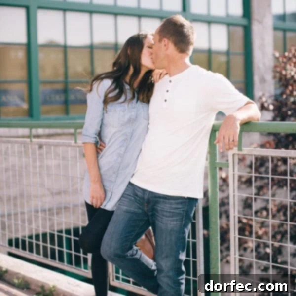 A photo of Cade and I smooching on a bridge.