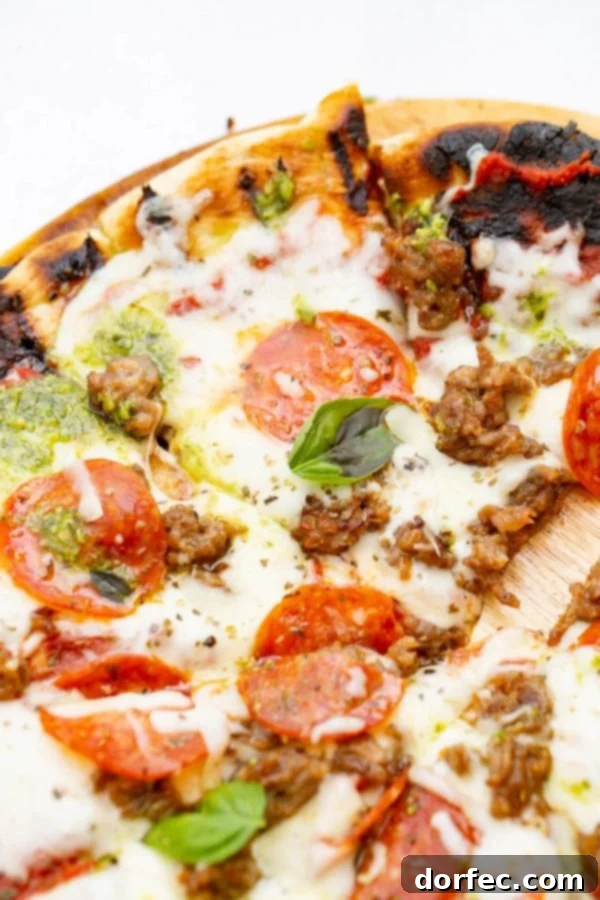 A photo of a piece of pesto pepperoni grilled pizza.
