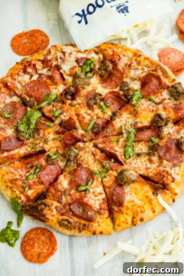 A photo of a pesto pepperoni grilled pizza.