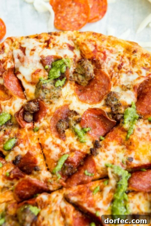 A photo of a pesto pepperoni grilled pizza.