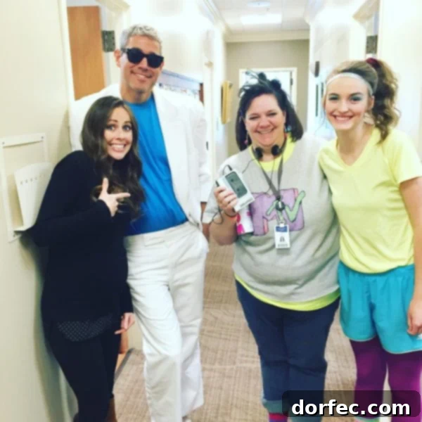 A photo of me with my doctor and two nurses all in their Halloween costumes, smiling brightly.