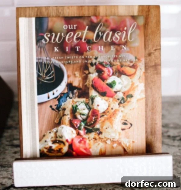 A photo of our cookbook sitting on a wooden stand, symbolizing hope and normalcy amidst challenges.