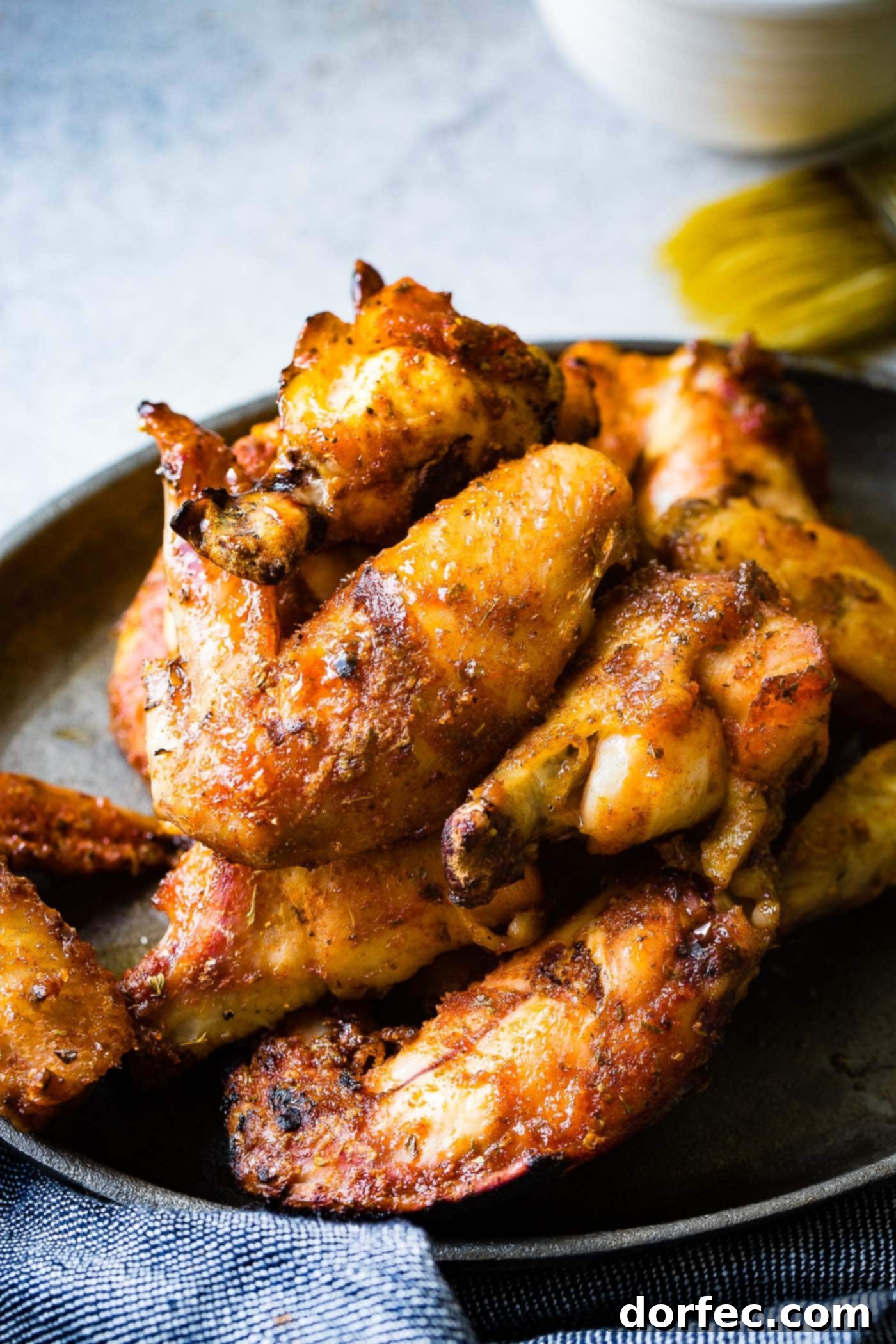 The BEST Dry Rubbed Smoked Chicken Wings A beautifully presented plate of smoked poultry, highlighting the rich colors and inviting textures of the dish.