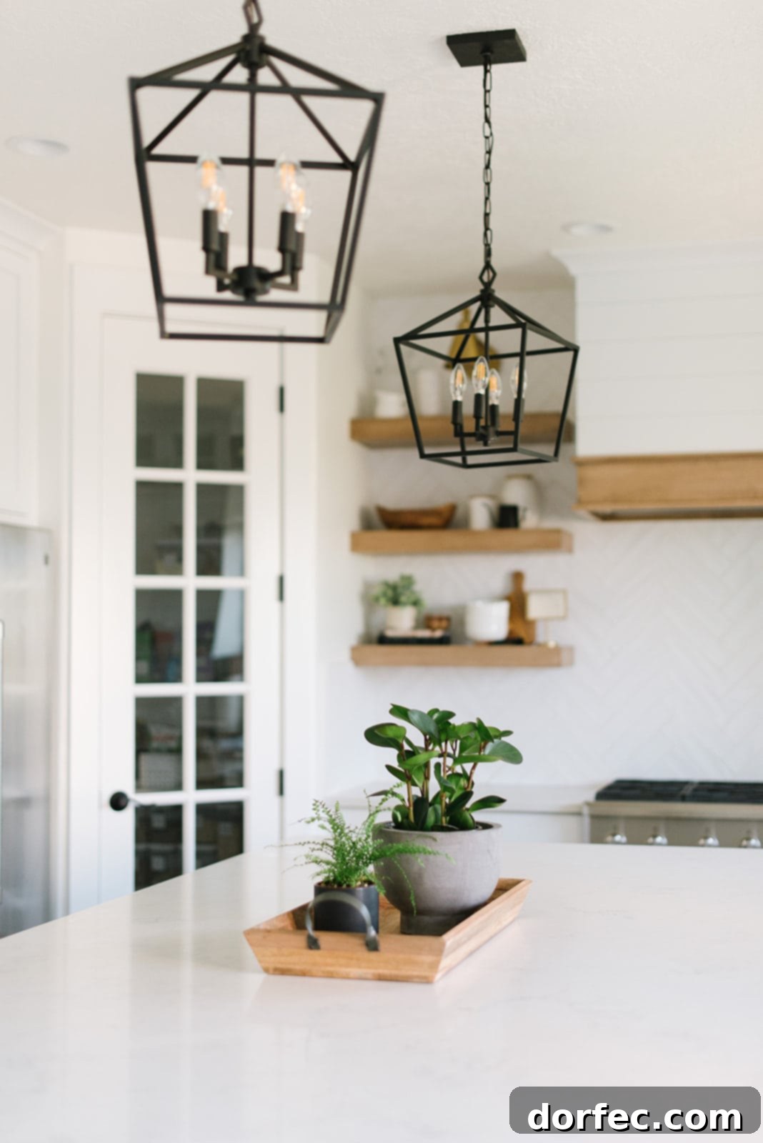 Close-up of the kitchen island with its pristine white countertop and new seating, reflecting modern design