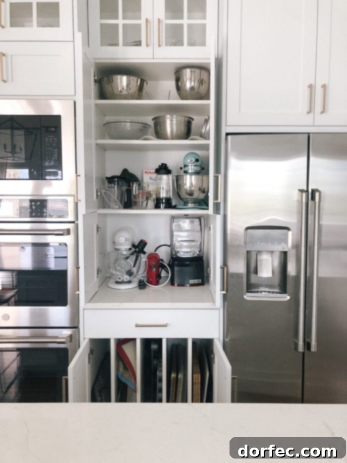 View of the all-white kitchen's clean lines and minimalist aesthetic, focusing on functionality and style