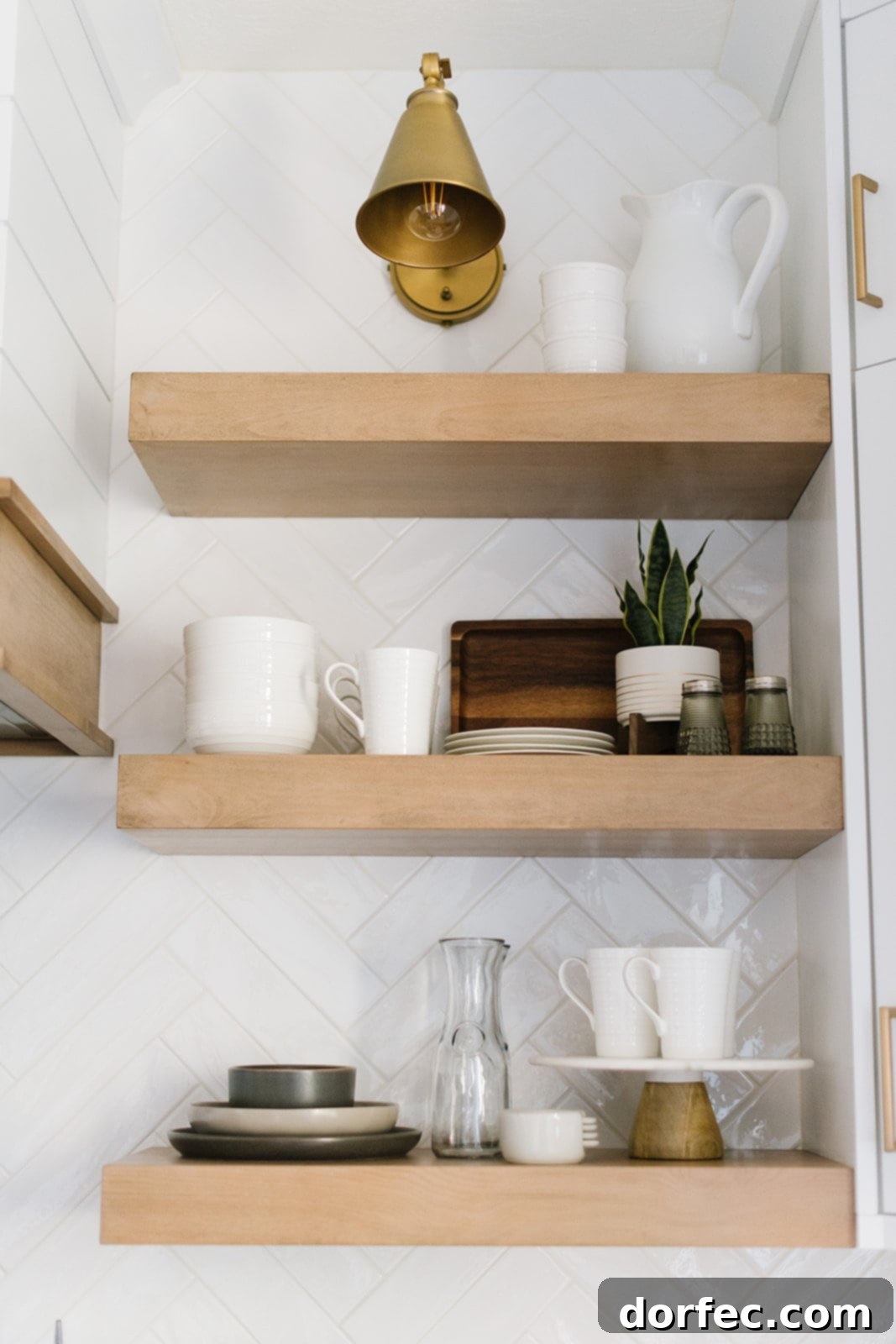 Panoramic view of the newly renovated all-white kitchen, showcasing the expansive island and integrated storage solutions