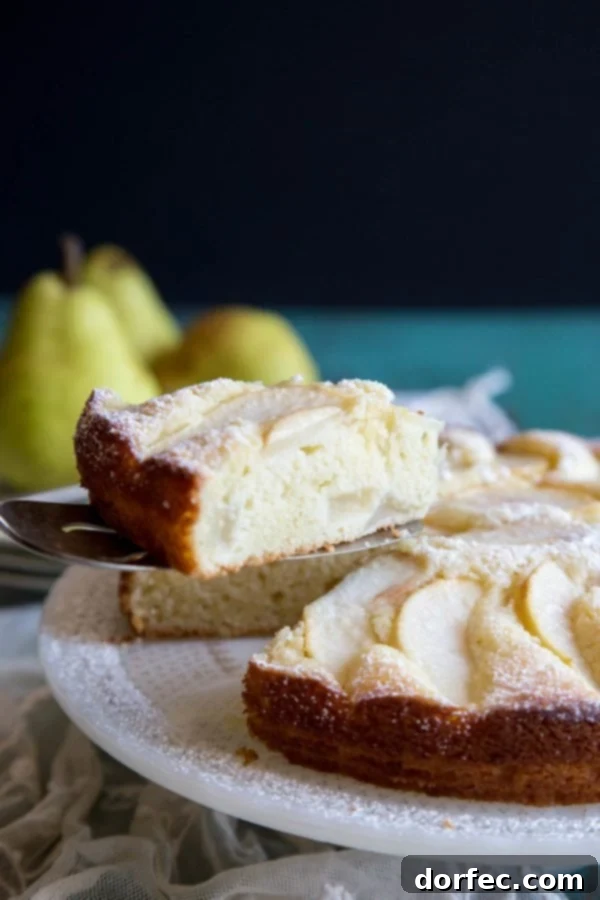 A slice of Italian pear cake being served, ready to be enjoyed