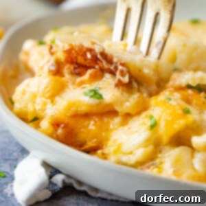 The Ultimate Cheesy Potato Casserole 11 A deliciously golden-brown cheesy potato casserole ready to serve.