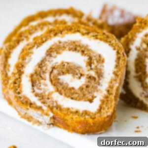 A freshly baked pumpkin roll with creamy filling.