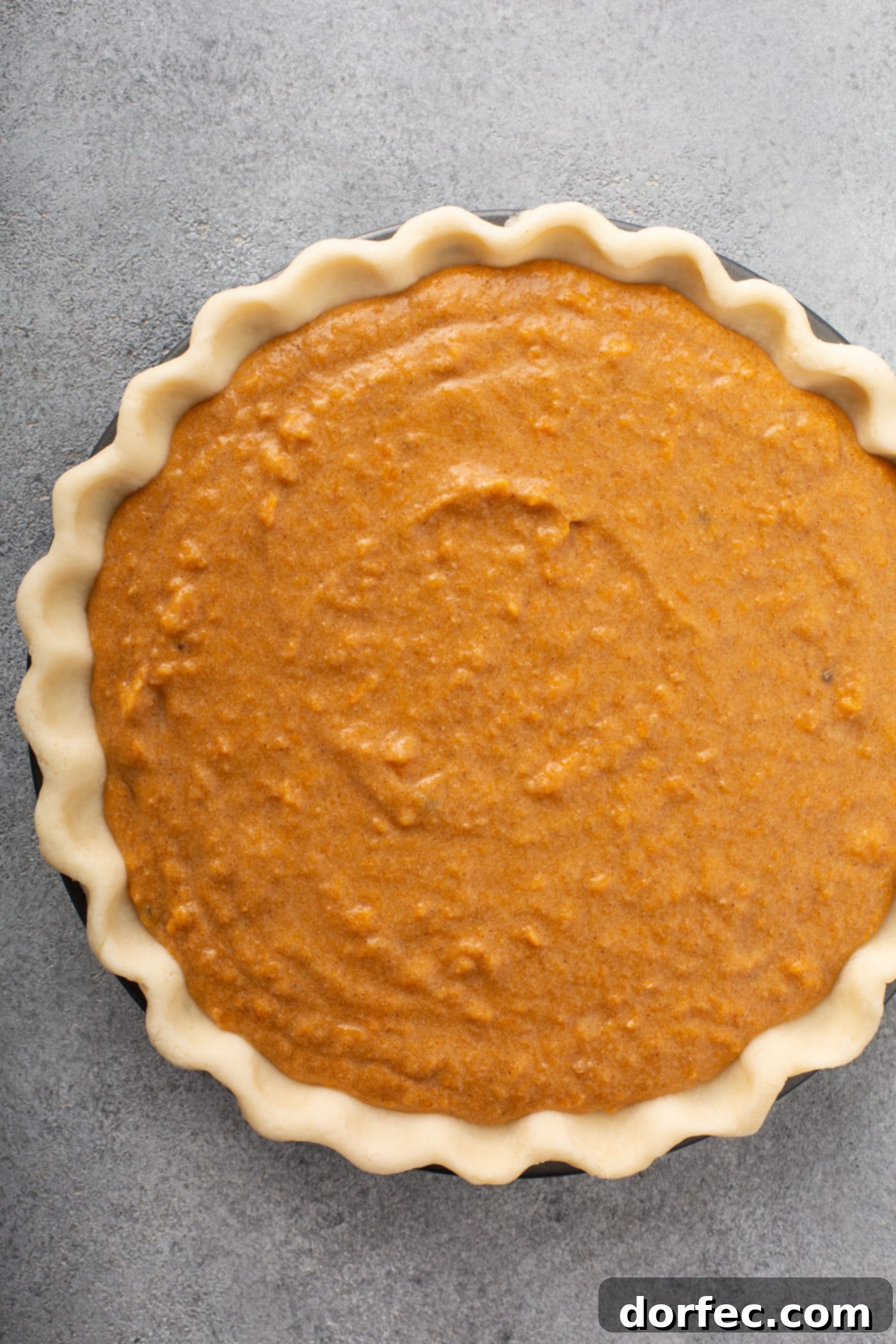 Southern Charm Sweet Potato Pie 5 A photo of an unbaked sweet potato pie.