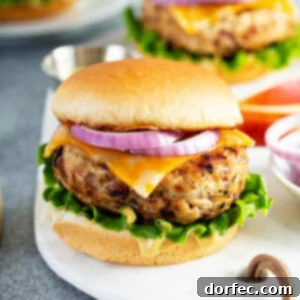 A cooked Maple Mustard Chicken Apple Burger
